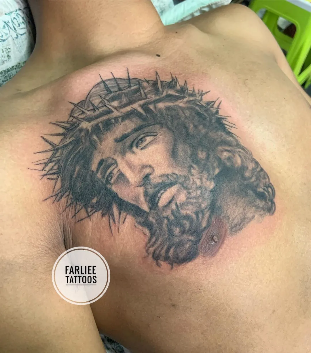 Jesus with crown of thorns tattoo
